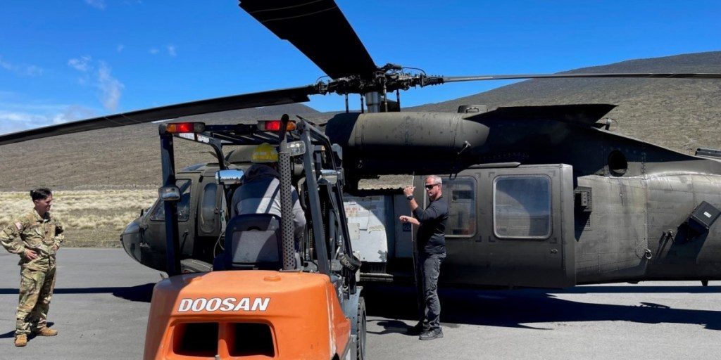 Shane L. Pollard unloads equipment delivered by military air during an emergency response mission. Pollard is a member of the Chemical, Biological, Radiological, Nuclear, Explosives (CBRNE) Analytical and Remediation Activity, an all U.S. Army civilian organization that conducts emergency response missions for Recovered Chemical Warfare Material, technical escort of surety and non-surety chemical material, and mobile laboratory operations (courtesy photo).