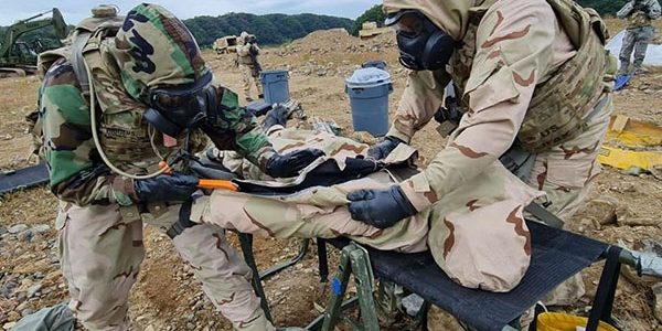 Soldiers from the 92nd Chemical Company's 2nd Platoon decontaminate an armored unit that was hit with a simulated chemical attack during Exercise Warrior Bulldog Strike. The Fort Stewart, Georgia-based company is deployed to support the Fort Bliss, Texas-based 3rd Armored Brigade Combat Team, 1st Armored Division, as a part of a regular rotation of American combat forces to South Korea. Courtesy photo.